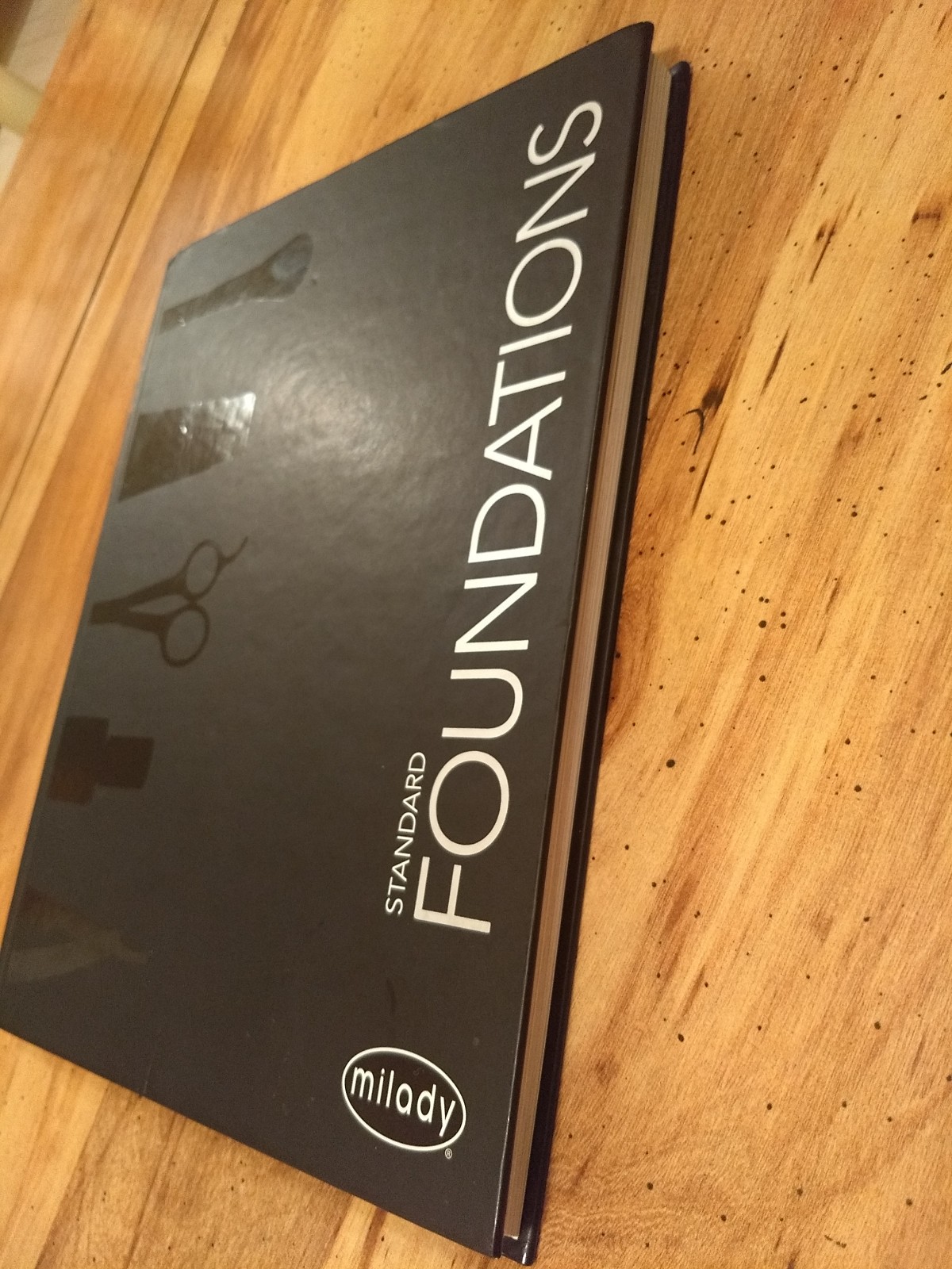 Milady Standard Foundations by Milady Cengage Learning Hardcover text book